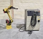 Fanuc A05B-1215-B601 Arc Mate 100IB Robot W/ R-J3IB Controller & A05B-2490-C172. Fixed Price $5400.00.